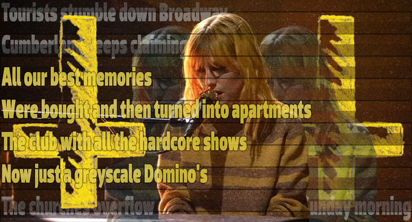 Fuzzy image of Hayley Williams singing in a striped sweater. Scanlines cut the image and ghostly versions of Williams sit behind her. An upside down yellow cross sits in front and behind.